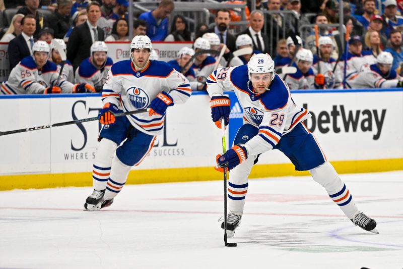 Feb 15, 2024; St. Louis, Missouri, USA;  Edmonton Oilers center Leon Draisaitl (29) controls the puck against the St. Louis Blues during the first period at Enterprise Center. Mandatory Credit: Jeff Curry-USA TODAY Sports