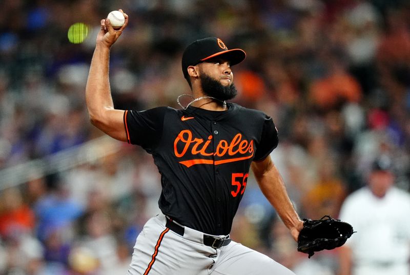 Aug 30, 2024; Denver, Colorado, USA; Baltimore Orioles relief pitcher Seranthony Dominguez (56) delivers a pitch in the ninth inning against the Colorado Rockies at Coors Field. Mandatory Credit: Ron Chenoy-USA TODAY Sports