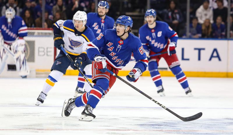 Nov 25, 2024; New York, New York, USA; New York Rangers left wing Brett Berard (65) skates in his NHL debut against the St. Louis Blues during the second period at Madison Square Garden. Mandatory Credit: Danny Wild-Imagn Images