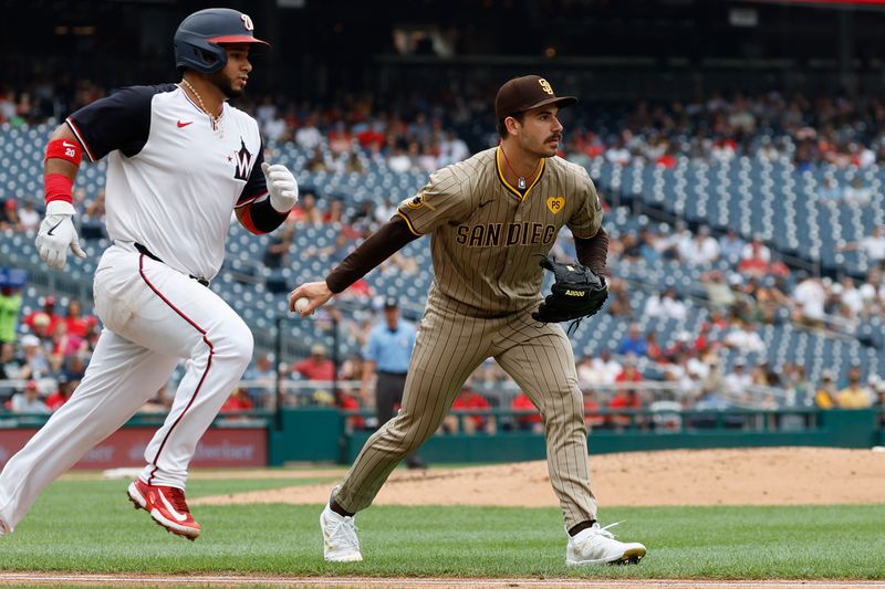 Jul 25, 2024; Washington, District of Columbia, USA; San Diego Padres pitcher Dylan Cease (84) tosses a ground ball to first base hit by Washington Nationals catcher Keibert Ruiz (20) during the second inning at Nationals Park. Mandatory Credit: Geoff Burke-USA TODAY Sports