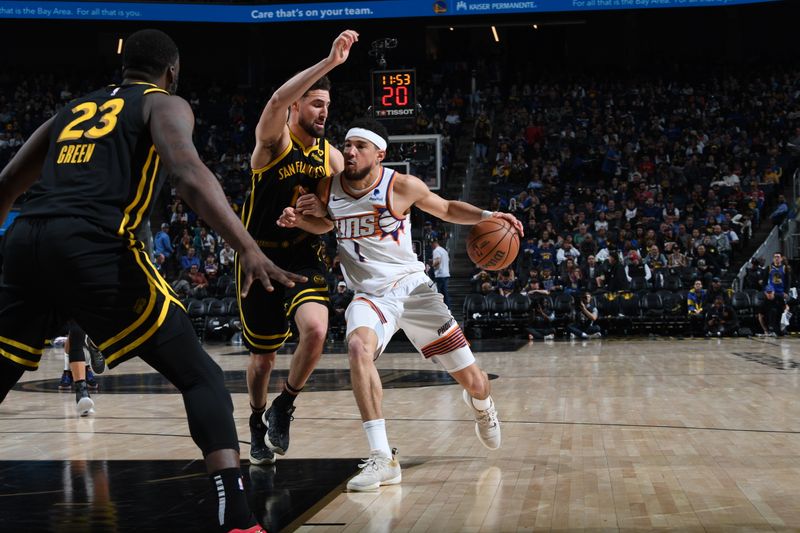 SAN FRANCISCO, CA - FEBRUARY 10: Devin Booker #1 of the Phoenix Suns drives to the basket during the game against the Golden State Warriors on February 10, 2024 at Chase Center in San Francisco, California. NOTE TO USER: User expressly acknowledges and agrees that, by downloading and or using this photograph, user is consenting to the terms and conditions of Getty Images License Agreement. Mandatory Copyright Notice: Copyright 2024 NBAE (Photo by Noah Graham/NBAE via Getty Images)