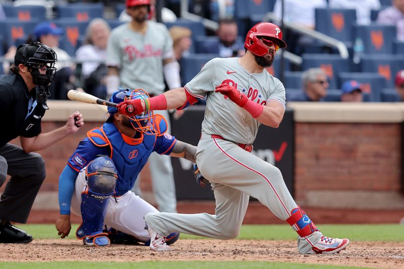 May 14, 2024; New York City, New York, USA; Philadelphia Phillies designated hitter Kyle Schwarber (12) follows through on a double during the ninth inning against the New York Mets at Citi Field. Mandatory Credit: Brad Penner-USA TODAY Sports