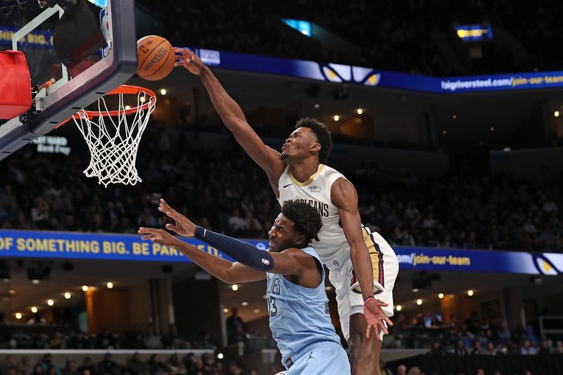 MEMPHIS, TENNESSEE - NOVEMBER 29: Yves Missi #21 of the New Orleans Pelicans goes to the basket against Jaren Jackson Jr. #13 of the Memphis Grizzlies during the second half of an Emirates NBA Cup game at FedExForum on November 29, 2024 in Memphis, Tennessee. NOTE TO USER: User expressly acknowledges and agrees that, by downloading and or using this photograph, User is consenting to the terms and conditions of the Getty Images License Agreement. (Photo by Justin Ford/Getty Images)