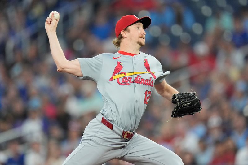 Sep 13, 2024; Toronto, Ontario, CAN; St. Louis Cardinals pitcher Erick Fedde (12) pitches to to the Toronto Blue Jays during the first inning at Rogers Centre. Mandatory Credit: John E. Sokolowski-Imagn Images