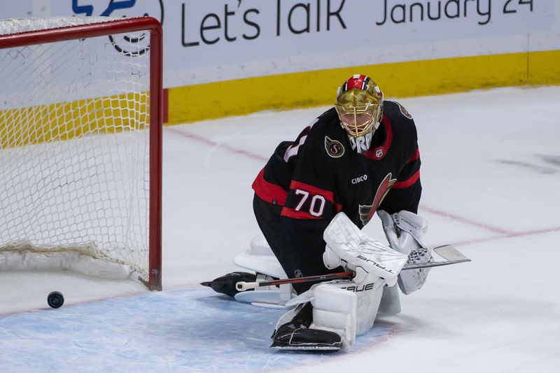 Jan 20, 2024; Ottawa, Ontario, CAN; Ottawa Senators goalie Joonas Koprpisalo (70) is unable to stop a shot from Winnipeg Jets left wing Nikolaj Ehlers (27-not pictured) in overtime at the Canadian Tire Centre. Mandatory Credit: Marc DesRosiers-USA TODAY Sports