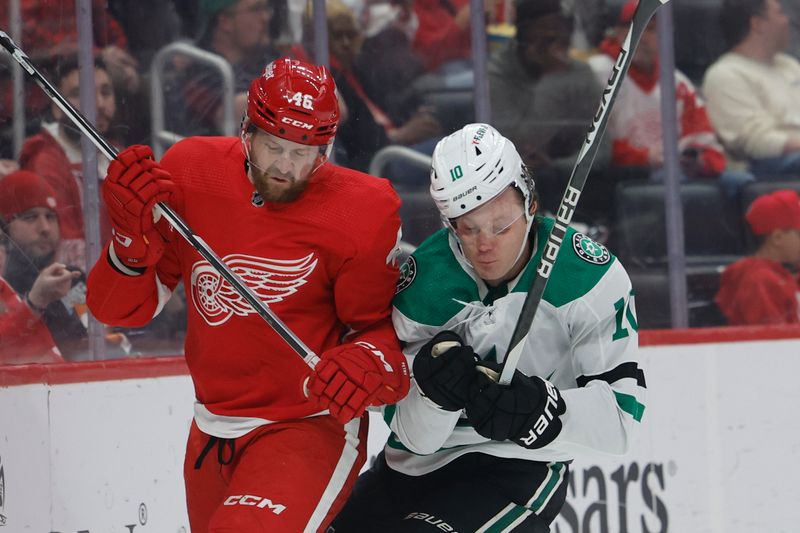 Jan 23, 2024; Detroit, Michigan, USA;  Detroit Red Wings defenseman Jeff Petry (46) and Dallas Stars center Ty Dellandrea (10) battle for the puck in the first period at Little Caesars Arena. Mandatory Credit: Rick Osentoski-USA TODAY Sports