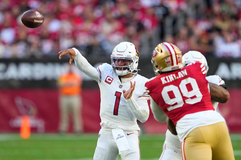 Arizona Cardinals quarterback Kyler Murray (1) passes as San Francisco 49ers defensive tackle Javon Kinlaw (99) applies pressure during the first half of an NFL football game, Sunday, Dec. 17, 2023, in Glendale, Ariz. (AP Photo/Matt York)