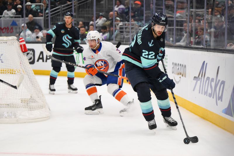 Nov 16, 2024; Seattle, Washington, USA; Seattle Kraken right wing Oliver Bjorkstrand (22) plays the puck during the third period against the New York Islanders at Climate Pledge Arena. Mandatory Credit: Steven Bisig-Imagn Images