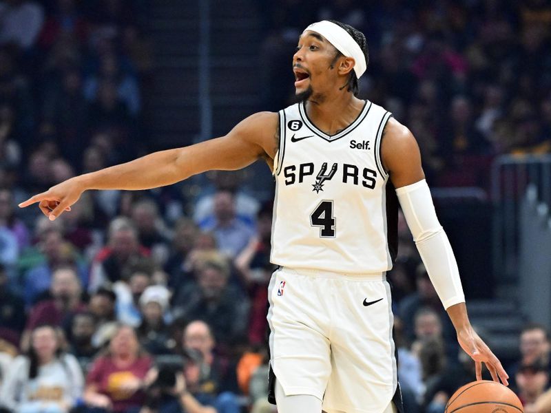 CLEVELAND, OHIO - FEBRUARY 13: Devonte' Graham #4 of the San Antonio Spurs yells to his teammates during the first quarter C at Rocket Mortgage Fieldhouse on February 13, 2023 in Cleveland, Ohio. NOTE TO USER: User expressly acknowledges and agrees that, by downloading and or using this photograph, User is consenting to the terms and conditions of the Getty Images License Agreement. (Photo by Jason Miller/Getty Images)