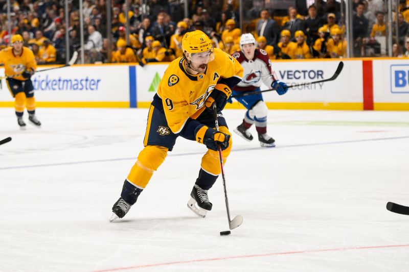 Nov 2, 2024; Nashville, Tennessee, USA;  Nashville Predators left wing Filip Forsberg (9) takes a shot on goal against the Colorado Avalanche during the third period at Bridgestone Arena. Mandatory Credit: Steve Roberts-Imagn Images