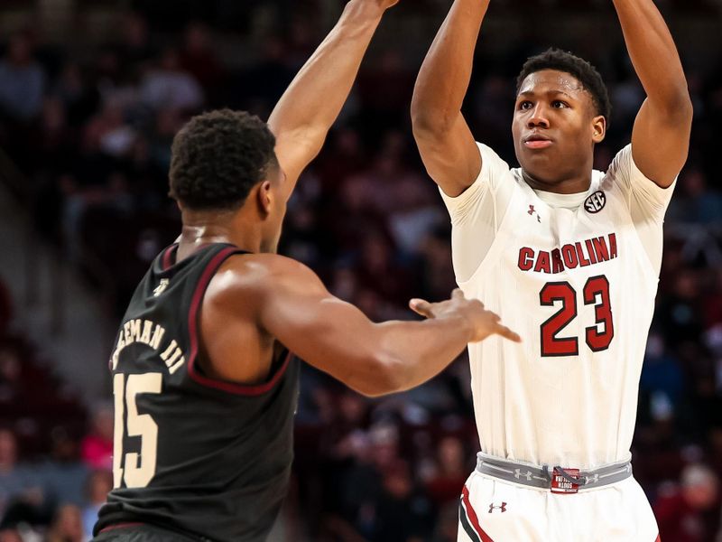 Jan 14, 2023; Columbia, South Carolina, USA; South Carolina Gamecocks forward Gregory Jackson II (23) shoots over Texas A&M Aggies forward Henry Coleman III (15) in the first half at Colonial Life Arena. Mandatory Credit: Jeff Blake-USA TODAY Sports