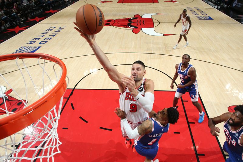 CHICAGO, IL - DECEMBER 8: Nikola Vucevic #9 of the Chicago Bulls drives to the basket during the game against the Philadelphia 76ers on December 8, 2024 at United Center in Chicago, Illinois. NOTE TO USER: User expressly acknowledges and agrees that, by downloading and or using this photograph, User is consenting to the terms and conditions of the Getty Images License Agreement. Mandatory Copyright Notice: Copyright 2024 NBAE (Photo by Gary Dineen/NBAE via Getty Images)