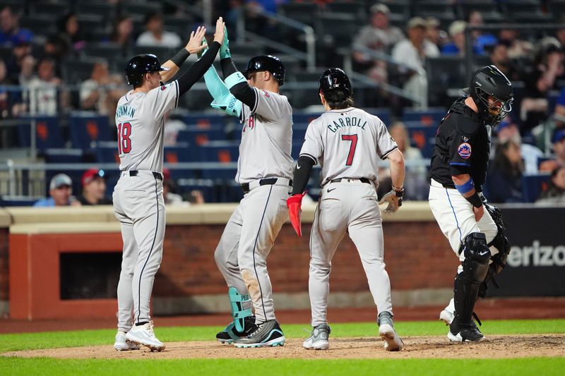 May 31, 2024; New York City, New York, USA; Arizona Diamondbacks shortstop Kevin Newman (18) and center fielder Corbin Carroll (7) congratulate designated hitter Joc Pederson (3) for hitting a three-run home run against the New York Mets during the ninth inning at Citi Field. Mandatory Credit: Gregory Fisher-USA TODAY Sports