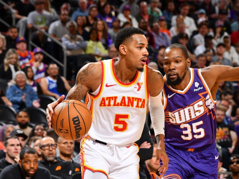 PHOENIX, AZ - MARCH 21:  Dejounte Murray #5 of the Atlanta Hawks goes to the basket during the game on March 21, 2024 at Footprint Center in Phoenix, Arizona. NOTE TO USER: User expressly acknowledges and agrees that, by downloading and or using this photograph, user is consenting to the terms and conditions of the Getty Images License Agreement. Mandatory Copyright Notice: Copyright 2024 NBAE (Photo by Barry Gossage/NBAE via Getty Images)