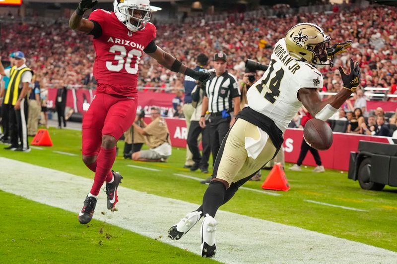 New Orleans Saints wide receiver Stanley Morgan Jr. (14) can't make the catch as Arizona Cardinals cornerback Darren Hall (30) defends in the first half of a preseason NFL football game, Saturday, Aug. 10, 2024, in Glendale, Ariz. (AP Photo/Ross D. Franklin)