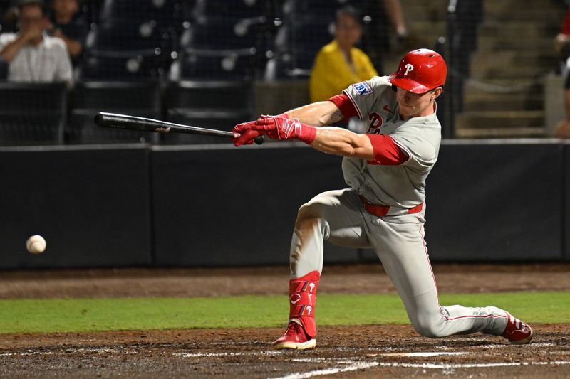 May 8, 2025; St. Petersburg, Florida, USA; Philadelphia Phillies right fielder Max Kepler (17) drives in the game tying run with a ground ball in the ninth inning against the Tampa Bay Rays at George M. Steinbrenner Field. Mandatory Credit: Jonathan Dyer-Imagn Images