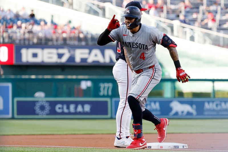 May 21, 2024; Washington, District of Columbia, USA; Minnesota Twins shortstop Carlos Correa (4) gestures toward his dugout after hitting a triple against the Washington Nationals during the first inning at Nationals Park. Mandatory Credit: Geoff Burke-USA TODAY Sports