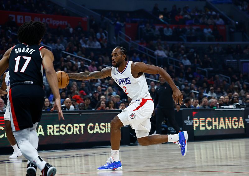 LOS ANGELES, CALIFORNIA - DECEMBER 11:  Kawhi Leonard #2 of the LA Clippers controls the ball against the Portland Trail Blazers in the first half at Crypto.com Arena on December 11, 2023 in Los Angeles, California.  NOTE TO USER: User expressly acknowledges and agrees that, by downloading and/or using this photograph, user is consenting to the terms and conditions of the Getty Images License Agreement. (Photo by Ronald Martinez/Getty Images)