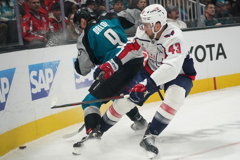 Dec 3, 2025; San Jose, California, USA;  Washington Capitals right winger Tom Wilson (43) chases the puck against San Jose Sharks defenseman Dmitry Orlov (9) in the first period at SAP Center at San Jose. Mandatory Credit: David Gonzales-Imagn Images