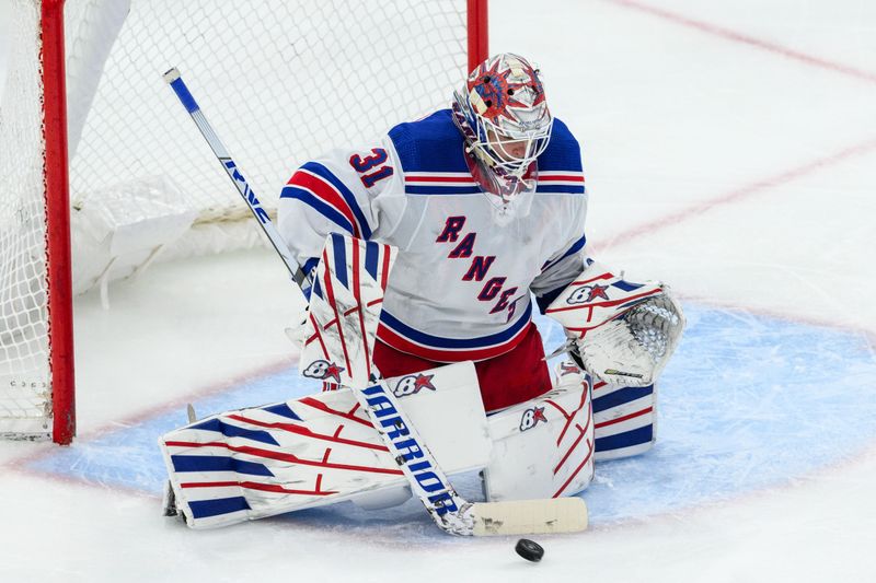 Feb 9, 2024; Chicago, Illinois, USA; New York Rangers goaltender Igor Shesterkin (31) makes a save against the Chicago Blackhawks during the third period at the United Center. Mandatory Credit: Daniel Bartel-USA TODAY Sports