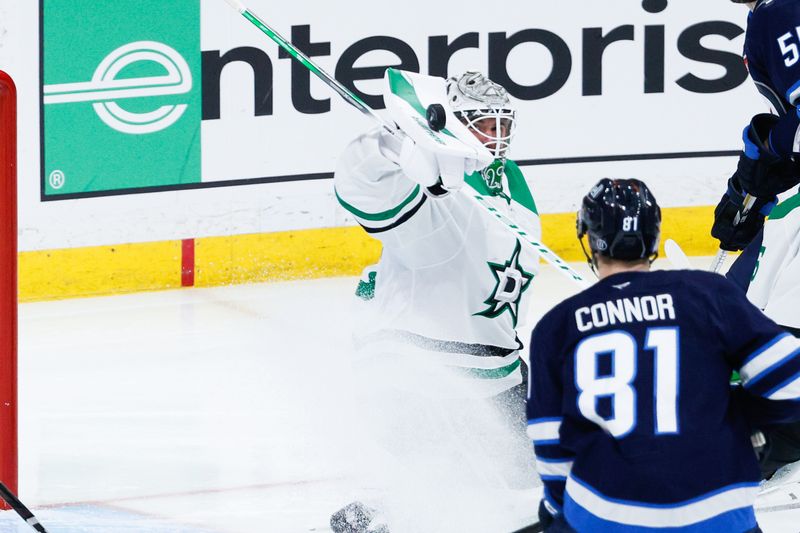 May 7, 2025; Winnipeg, Manitoba, CAN; Dallas Stars goalie Jake Oettinger (29) makes a save as Winnipeg Jets forward Kyle Connor (81) looks for a rebound during the third period in game one of the second round of the 2025 Stanley Cup Playoffs at Canada Life Centre. Mandatory Credit: Terrence Lee-Imagn Images