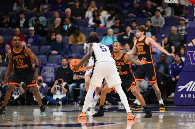 Mar 4, 2026; Seattle, Washington, USA; Southern California Trojans guard Jordan Marsh (7) guards Washington Huskies guard Zoom Diallo (5) during the second half at Alaska Airlines Arena at Hec Edmundson Pavilion. Mandatory Credit: Steven Bisig-Imagn Images
