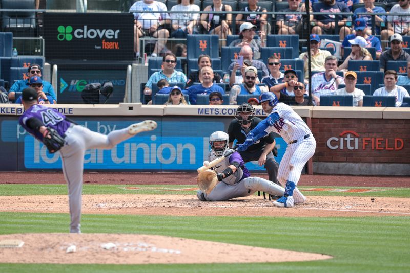 Jul 14, 2024; New York City, New York, USA;  New York Mets second baseman Jose Iglesias (11) singles during the sixth inning against Colorado Rockies relief pitcher Tyler Kinley (40) at Citi Field. Mandatory Credit: Vincent Carchietta-USA TODAY Sports