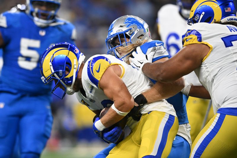 Detroit Lions linebacker Alex Anzalone (34) sacks Los Angeles Rams quarterback Matthew Stafford (9) during the first half of an NFL football game in Detroit, Sunday, Sept. 8, 2024. (AP Photo/David Dermer)