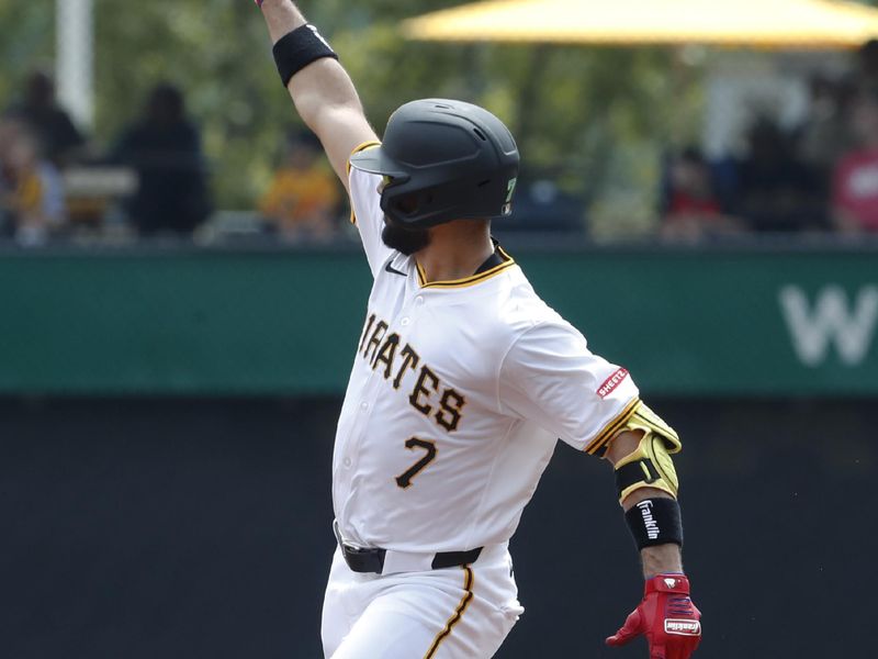 Aug 17, 2024; Pittsburgh, Pennsylvania, USA;  Pittsburgh Pirates shortstop Isiah Kiner-Falefa (7) gestures as he circles the bases on a solo home run against the Seattle Mariners during the first inning at PNC Park. Mandatory Credit: Charles LeClaire-USA TODAY Sports