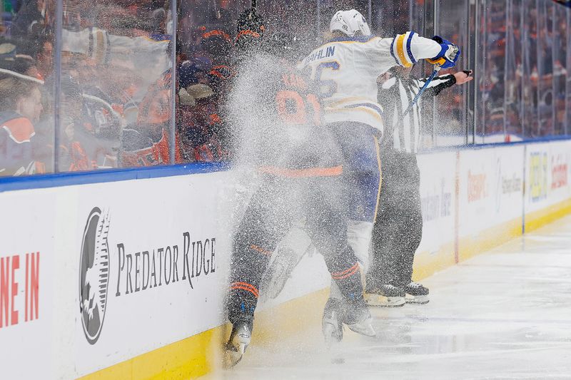 Mar 21, 2024; Edmonton, Alberta, CAN; Edmonton Oilers forward Evander Kane (91) checks Buffalo Sabres defensemen Rasmus Dahlin (26) during the second period at Rogers Place. Mandatory Credit: Perry Nelson-USA TODAY Sports