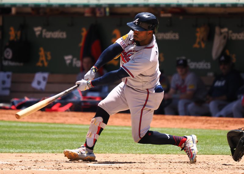 May 31, 2023; Oakland, California, USA; Atlanta Braves second baseman Ozzie Albies (1) hits a two-run home run against the Oakland Athletics during the fifth inning at Oakland-Alameda County Coliseum. Mandatory Credit: Kelley L Cox-USA TODAY Sports