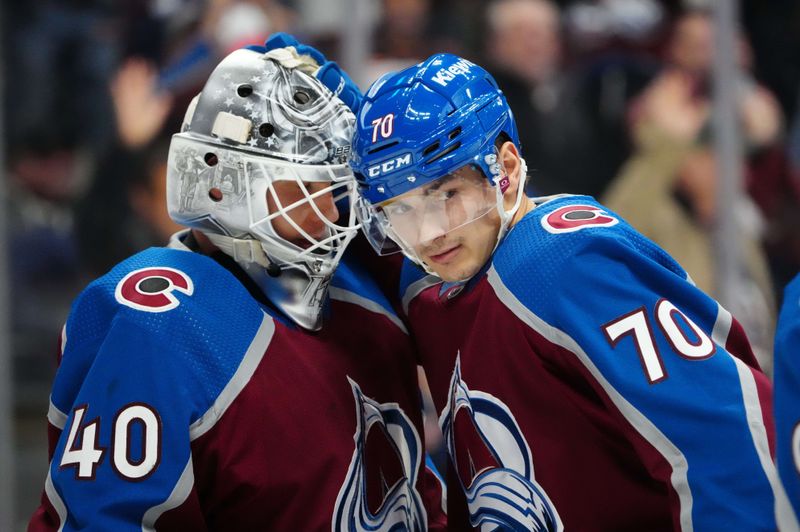 Jan 10, 2024; Denver, Colorado, USA; Colorado Avalanche defenseman Sam Malinski (70) and goaltender Alexandar Georgiev (40) celebrate defeating the Vegas Golden Knights at Ball Arena. Mandatory Credit: Ron Chenoy-USA TODAY Sports