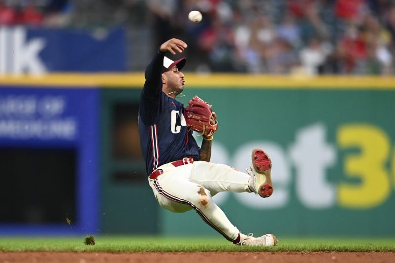 Jul 22, 2024; Cleveland, Ohio, USA; Cleveland Guardians shortstop Brayan Rocchio (4) attempts to throw out Detroit Tigers left fielder Mark Canha (not pictured) during the eighth inning at Progressive Field. Mandatory Credit: Ken Blaze-USA TODAY Sports