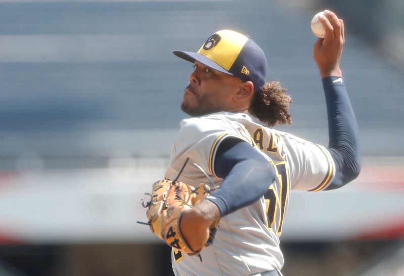 Sep 6, 2023; Pittsburgh, Pennsylvania, USA;  Milwaukee Brewers starting pitcher Freddy Peralta (51) delivers a pitch against the Pittsburgh Pirates during the first inning at PNC Park. Mandatory Credit: Charles LeClaire-USA TODAY Sports