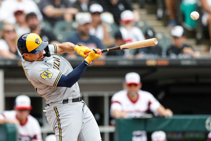 Aug 13, 2023; Chicago, Illinois, USA; Milwaukee Brewers shortstop Willy Adames (27) singles against the Chicago White Sox during the second inning at Guaranteed Rate Field. Mandatory Credit: Kamil Krzaczynski-USA TODAY Sports