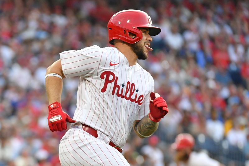 Jun 17, 2024; Philadelphia, Pennsylvania, USA; Philadelphia Phillies catcher Rafael Marchán (13) watches his RBI single during the fourth inning against the San Diego Padres at Citizens Bank Park. Mandatory Credit: Eric Hartline-USA TODAY Sports