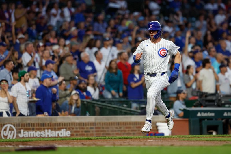 Sep 4, 2024; Chicago, Illinois, USA; Chicago Cubs second baseman Nico Hoerner (2) runs to score against the Pittsburgh Pirates during the second inning at Wrigley Field. Mandatory Credit: Kamil Krzaczynski-Imagn Images