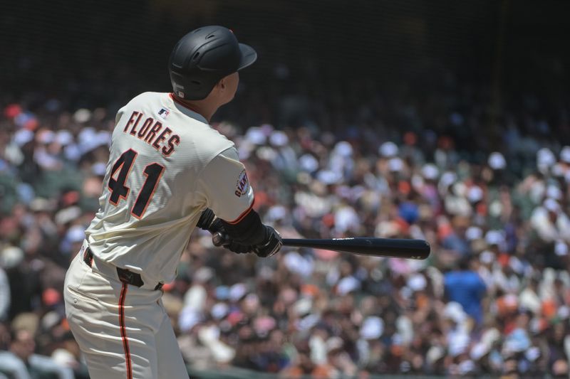 Jun 7, 2025; San Francisco, California, USA;  San Francisco Giants first baseman Wilmer Flores (41) hits a home run against the Atlanta Braves during the fourth inning at Oracle Park. Mandatory Credit: Ed Szczepanski-Imagn Images