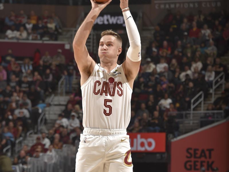 CLEVELAND, OH - NOVEMBER 9: Sam Merrill #5 of the Cleveland Cavaliers three point basket during the game against the Brooklyn Nets on November 9, 2024 at Rocket Mortgage FieldHouse in Cleveland, Ohio. NOTE TO USER: User expressly acknowledges and agrees that, by downloading and/or using this Photograph, user is consenting to the terms and conditions of the Getty Images License Agreement. Mandatory Copyright Notice: Copyright 2024 NBAE (Photo by David Liam Kyle/NBAE via Getty Images)