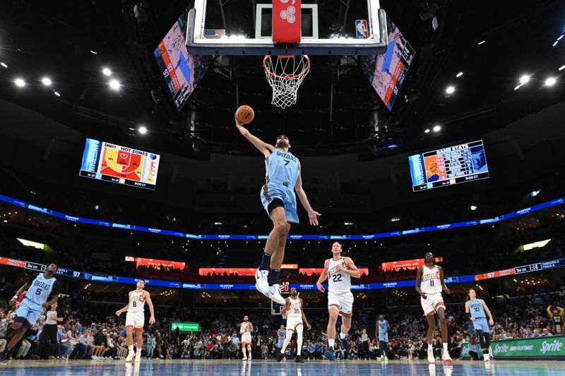 MEMPHIS, TN - FEBRUARY 25: Santi Aldama #7 of the Memphis Grizzlies dunks the ball during the game against the Phoenix Suns on February 25, 2025 at FedExForum in Memphis, Tennessee. NOTE TO USER: User expressly acknowledges and agrees that, by downloading and or using this photograph, User is consenting to the terms and conditions of the Getty Images License Agreement. Mandatory Copyright Notice: Copyright 2025 NBAE(Photo by Grant Burke/NBAE via Getty Images)