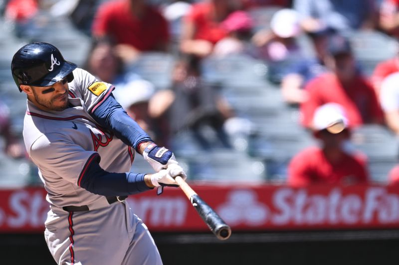 Aug 18, 2024; Anaheim, California, USA; Atlanta Braves outfielder Ramón Laureano (18) hits a home run against the Los Angeles Angels during the fourth inning at Angel Stadium. Mandatory Credit: Jonathan Hui-USA TODAY Sports