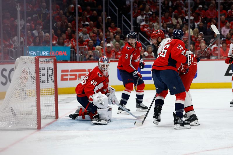 May 6, 2025; Washington, District of Columbia, USA; Washington Capitals goaltender Logan Thompson (48) is beaten by a shot by Carolina Hurricanes defenseman Jaccob Slavin (not pictured) in overtime in game one of the second round of the 2025 Stanley Cup Playoffs at Capital One Arena. Mandatory Credit: Geoff Burke-Imagn Images