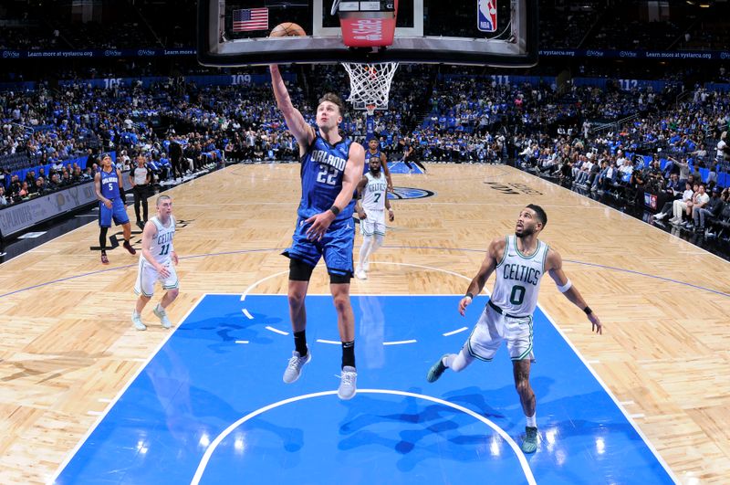 ORLANDO, FL - APRIL 27:   Franz Wagner #22 of the Orlando Magic drives to the basket during the game against the Boston Celtics during Round 1 Game 4 of the 2025 NBA Playoffs on April 27, 2025 at Kia Center in Orlando, Florida. NOTE TO USER: User expressly acknowledges and agrees that, by downloading and or using this photograph, User is consenting to the terms and conditions of the Getty Images License Agreement. Mandatory Copyright Notice: Copyright 2025 NBAE (Photo by Fernando Medina/NBAE via Getty Images)