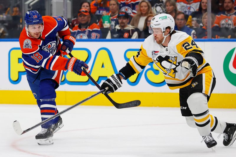 Oct 25, 2024; Edmonton, Alberta, CAN; Edmonton Oilers forward Zach Hyman (18) gets a shot away in front of Pittsburgh Penguins defensemen Kit Grzelcyk (24) during the first period at Rogers Place. Mandatory Credit: Perry Nelson-Imagn Images