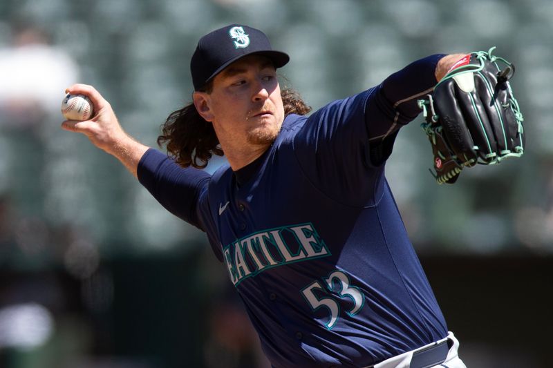 Jun 6, 2024; Oakland, California, USA; Seattle Mariners pitcher Mike Baumann (53) delivers a pitch against the Oakland Athletics during the eighth inning at Oakland-Alameda County Coliseum. Mandatory Credit: D. Ross Cameron-USA TODAY Sports