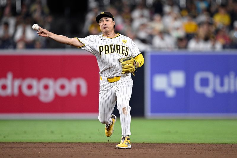 Jun 24, 2024; San Diego, California, USA; San Diego Padres shortstop Ha-Seong Kim (7) throws to first base during the ninth inning against the Washington Nationals at Petco Park. Mandatory Credit: Orlando Ramirez-USA TODAY Sports