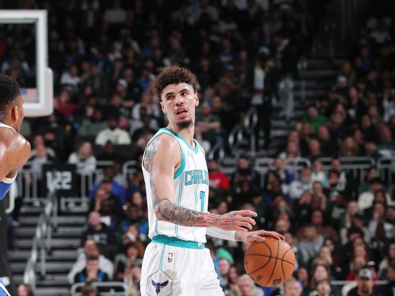 MILWAUKEE, WI - NOVEMBER 23: LaMelo Ball #1 of the Charlotte Hornets looks to pass the ball during the game against the Milwaukee Bucks on November 23, 2024 at the Fiserv Forum Center in Milwaukee, Wisconsin. NOTE TO USER: User expressly acknowledges and agrees that, by downloading and or using this Photograph, user is consenting to the terms and conditions of the Getty Images License Agreement. Mandatory Copyright Notice: Copyright 2023 NBAE (Photo by Gary Dineen/NBAE via Getty Images).
