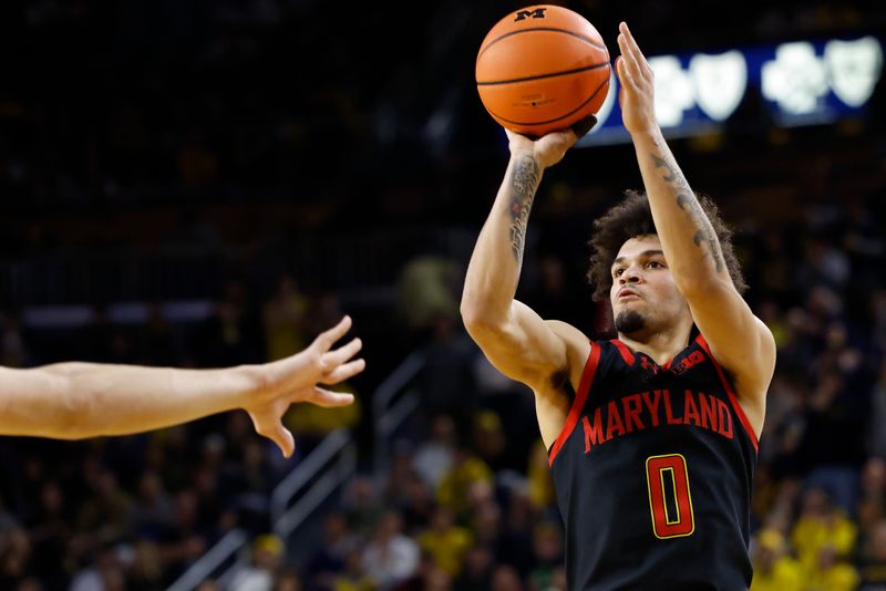 Mar 5, 2025; Ann Arbor, Michigan, USA;  Maryland Terrapins Donald Carey (0) shoots in the second half against the Michigan Wolverines at Crisler Center. Mandatory Credit: Rick Osentoski-Imagn Images