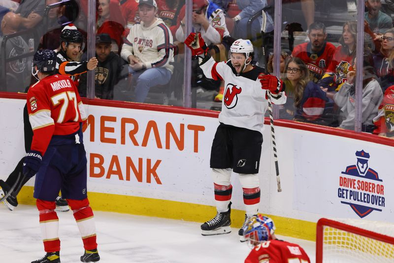 Nov 12, 2024; Sunrise, Florida, USA; New Jersey Devils center Paul Cotter (47) celebrates after scoring against the Florida Panthers during the third period at Amerant Bank Arena. Mandatory Credit: Sam Navarro-Imagn Images