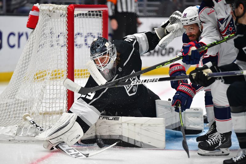 Mar 16, 2023; Los Angeles, California, USA; Los Angeles Kings goaltender Pheonix Copley (29) blocks a shot as Columbus Blue Jackets center Boone Jenner (38) moves in for the rebound during the first period at Crypto.com Arena. Mandatory Credit: Gary A. Vasquez-USA TODAY Sports